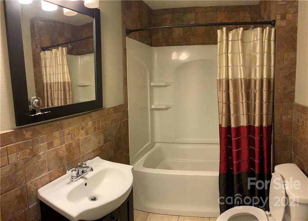 317 Tryon Road Rutherfordton, NC 28139 - Photo 6 of 10 a bathroom with a sink a toilet and shower