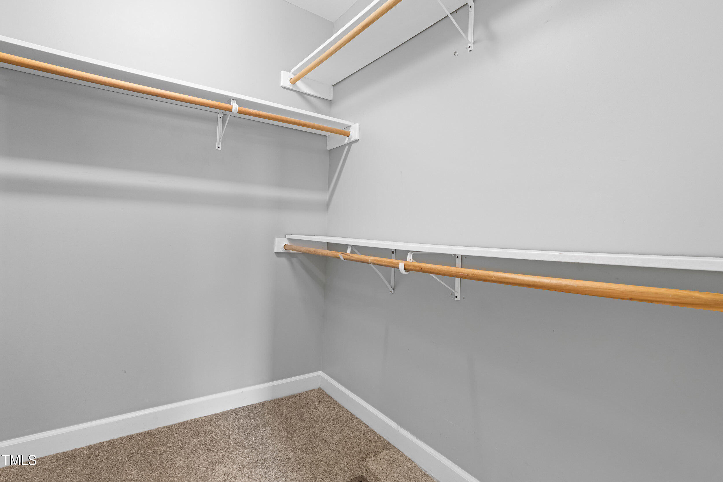 741 Rockville Road Wake Forest, NC 27587 - Photo 25 of 42 Nice walk in closet with wood shelving!