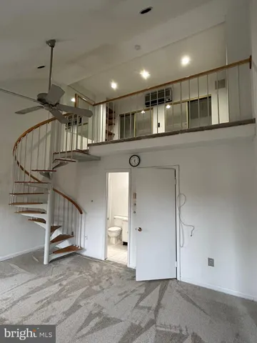 a view of entryway and kitchen