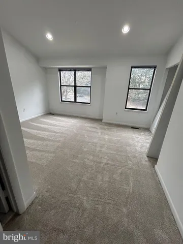 a view of an empty room and window