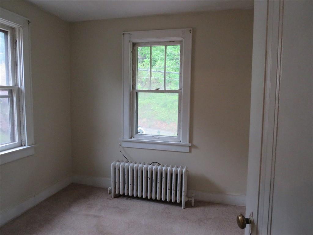 423 Braddock Road Pittsburgh, PA 15221 - Photo 17 of 36 an empty room with a window