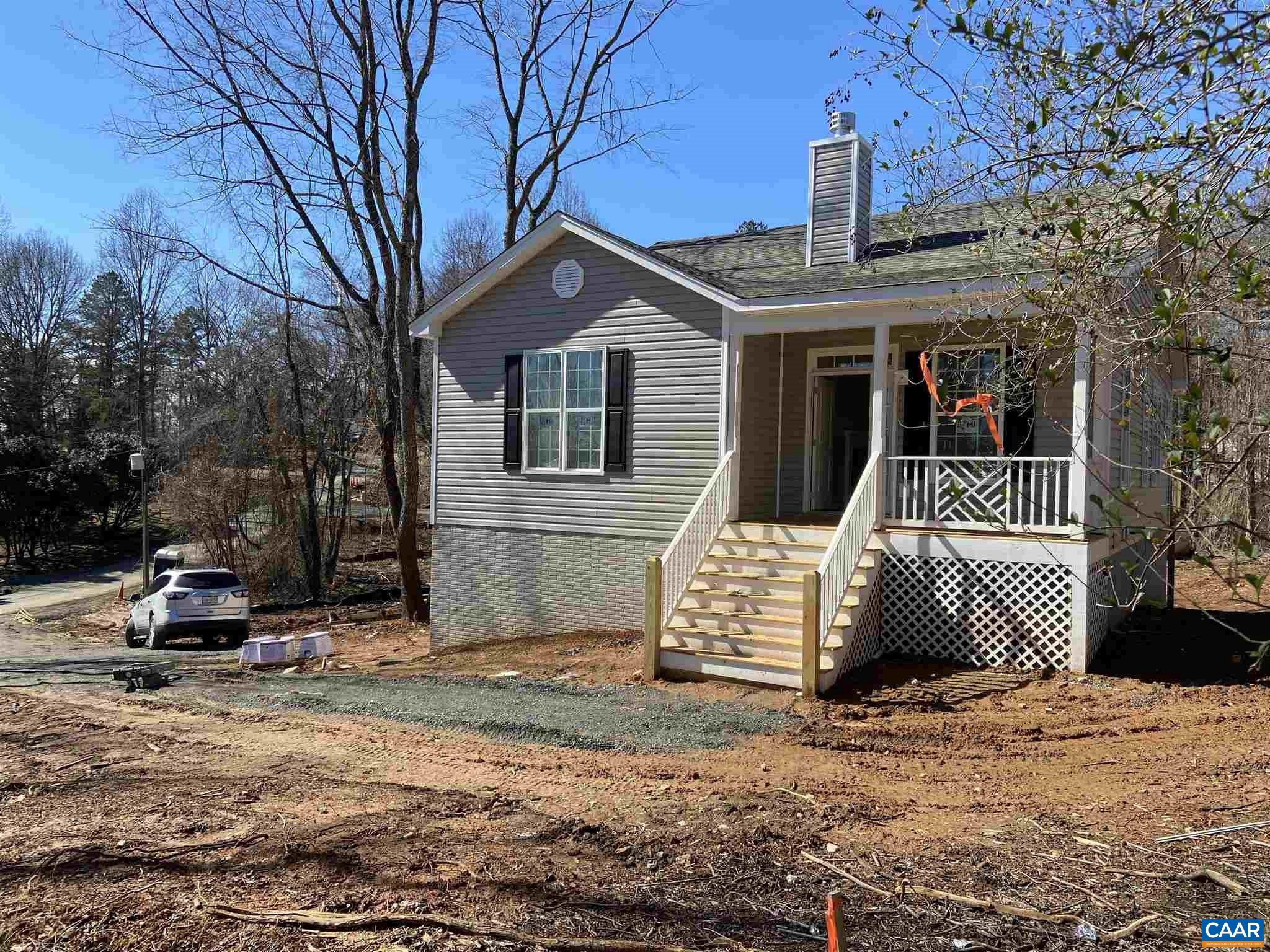 551 West Daffodil Road Ruckersville, VA 22968 - Photo 1 of 20 a front view of a house with a yard
