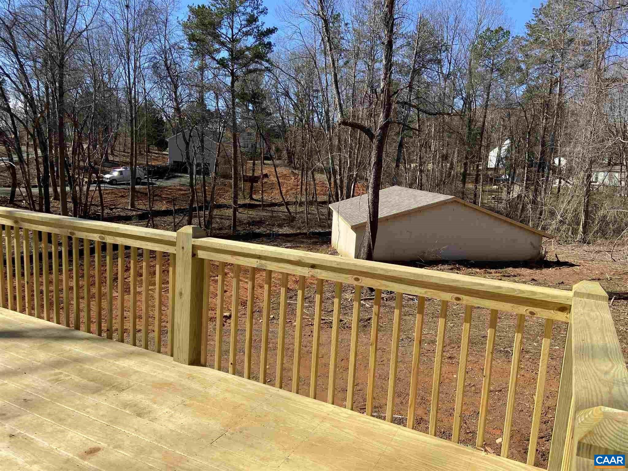 551 West Daffodil Road Ruckersville, VA 22968 - Photo 17 of 20 a view of a house with a wooden fence
