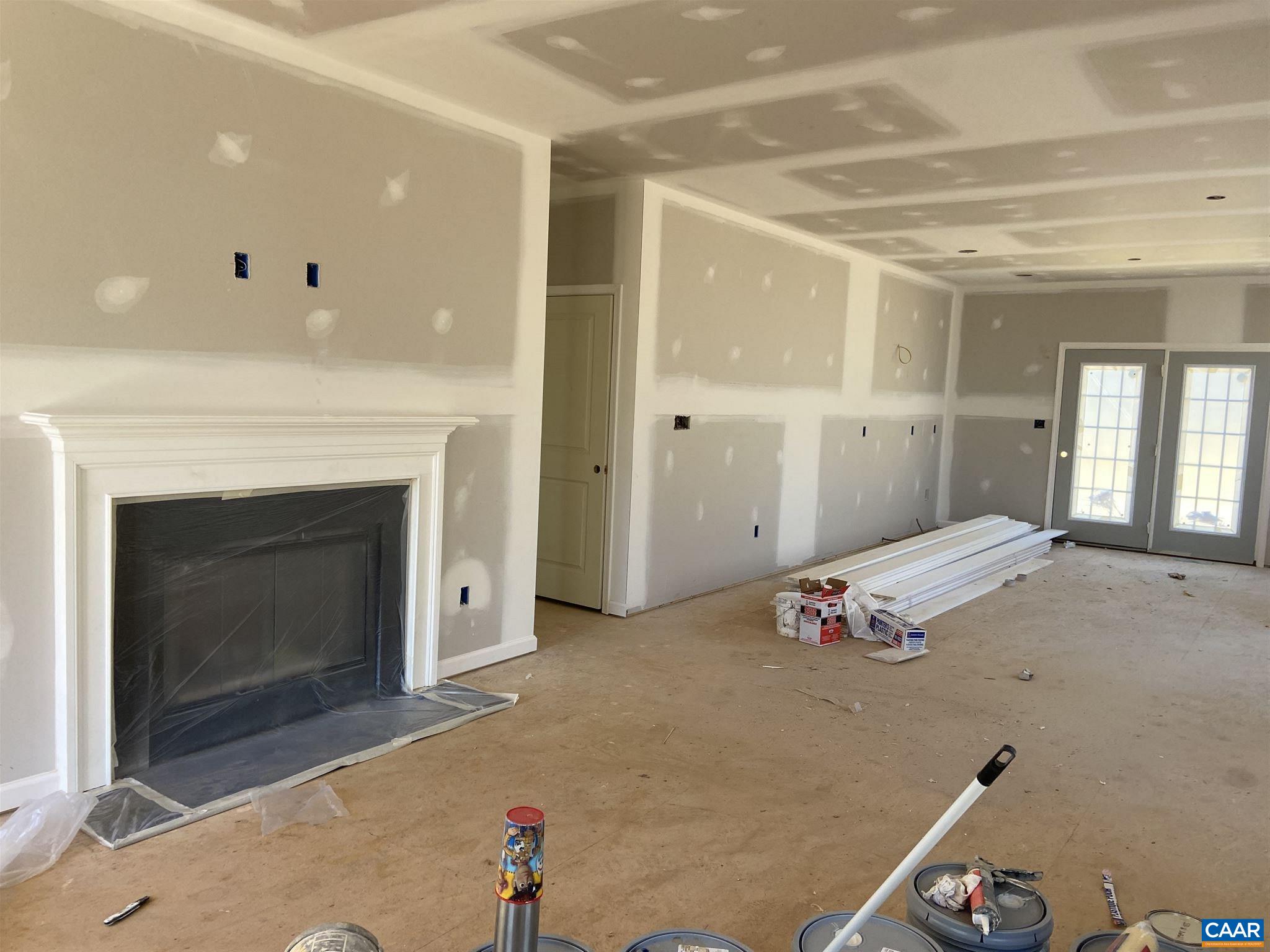 551 West Daffodil Road Ruckersville, VA 22968 - Photo 7 of 20 a bedroom with a bed and a fireplace