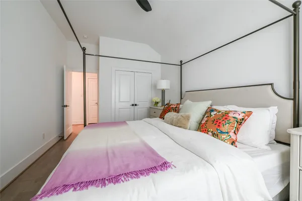 a living room with furniture a flat screen tv and a window