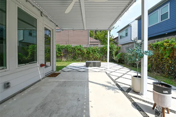 a view of a backyard with sitting area