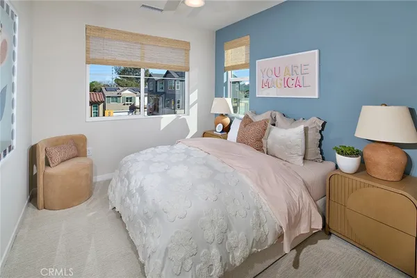 a bedroom with bed and a couch