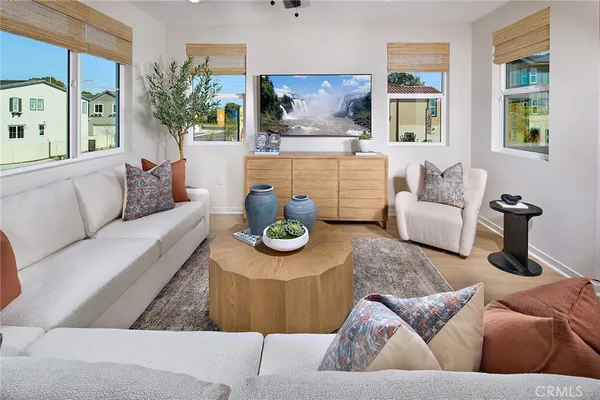 a living room with furniture and a large window