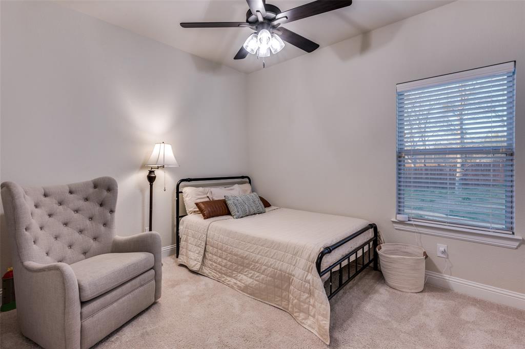 331 Osage Court Krum, TX 76249 - Photo 14 of 18 Guest Bedroom with large closet and fan