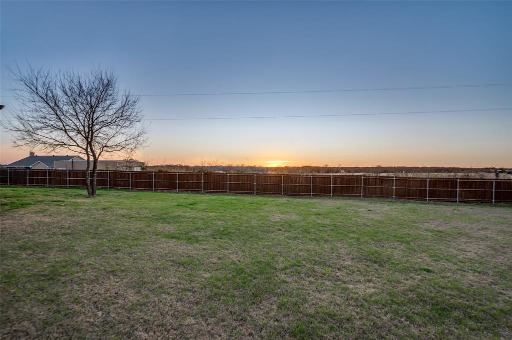 331 Osage Court Krum, TX 76249 - Photo 4 of 18 West-facing back porch. Incredible Texas sunsets
