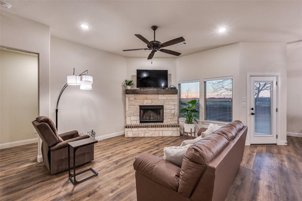 331 Osage Court Krum, TX 76249 - Photo 6 of 18 Wood-burning fireplace, upgraded fixtures