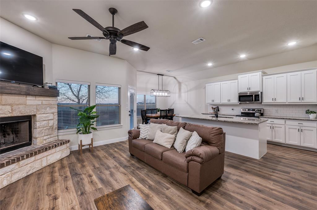 331 Osage Court Krum, TX 76249 - Photo 7 of 18 West wall full of windows!