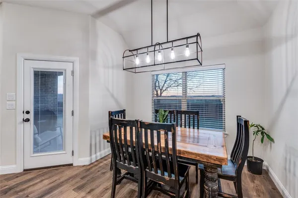 a kitchen with stainless steel appliances granite countertop a sink refrigerator and microwave