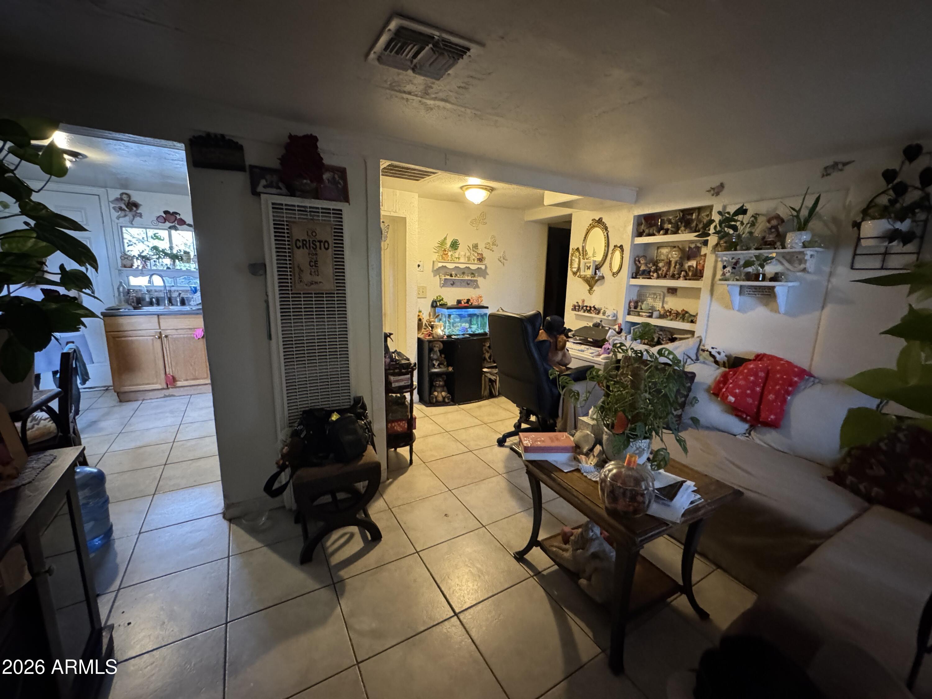 740 West Cinnabar Avenue Phoenix, AZ 85021 - Photo 15 of 26 a living room with furniture and a flat screen tv