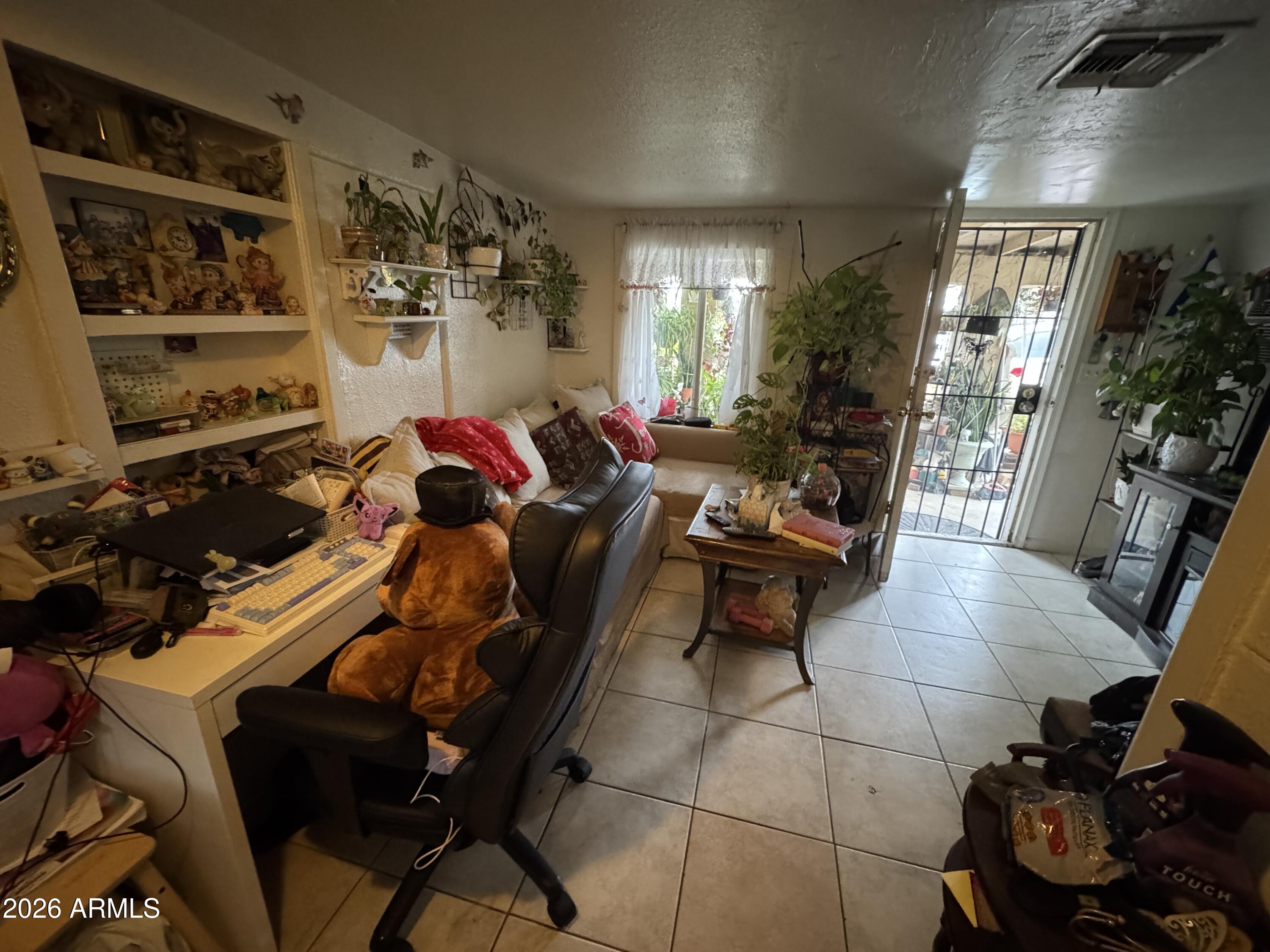 740 West Cinnabar Avenue Phoenix, AZ 85021 - Photo 17 of 26 a living room with furniture and a window