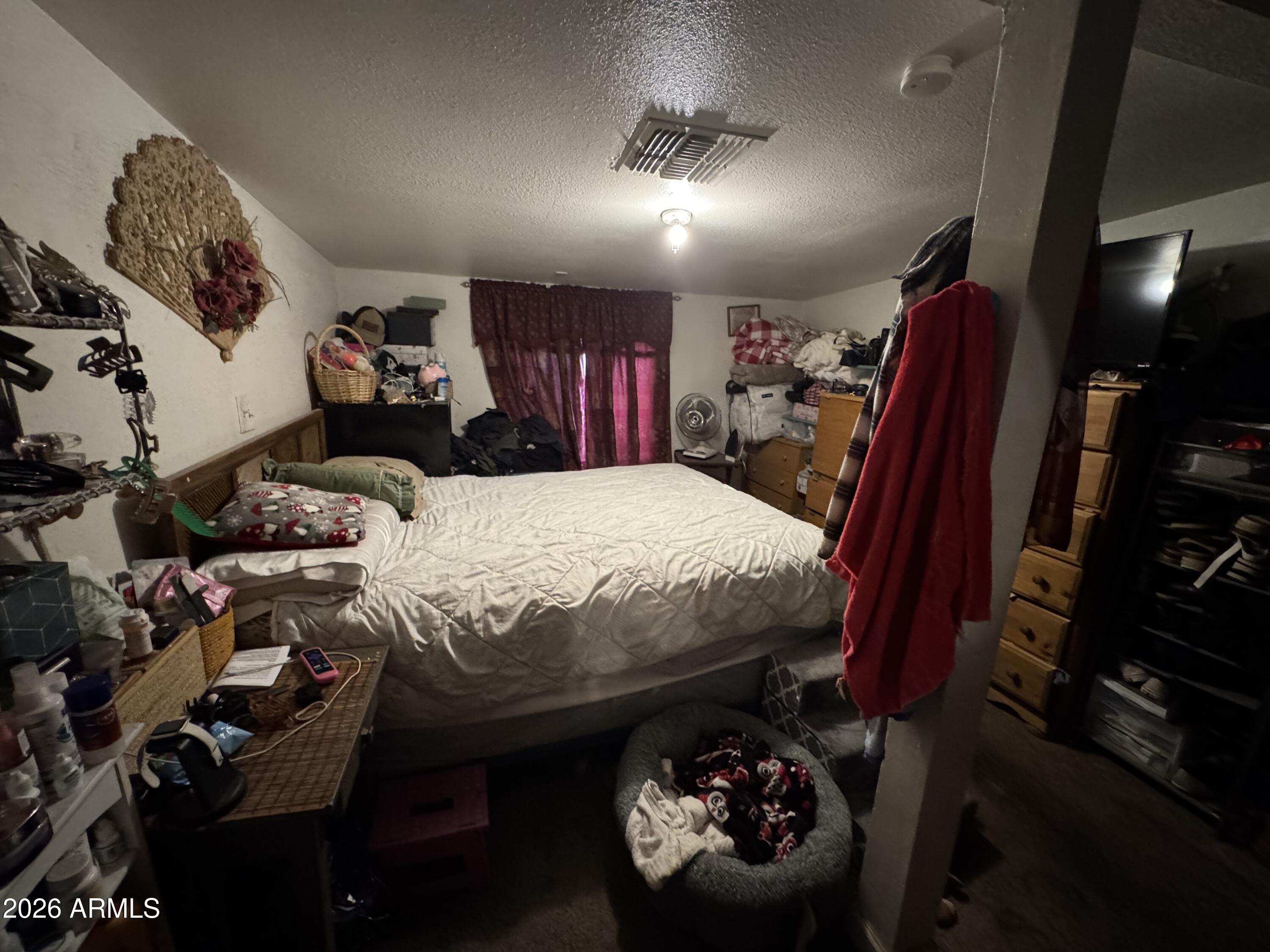 740 West Cinnabar Avenue Phoenix, AZ 85021 - Photo 20 of 26 a bed sitting in a room next to a window