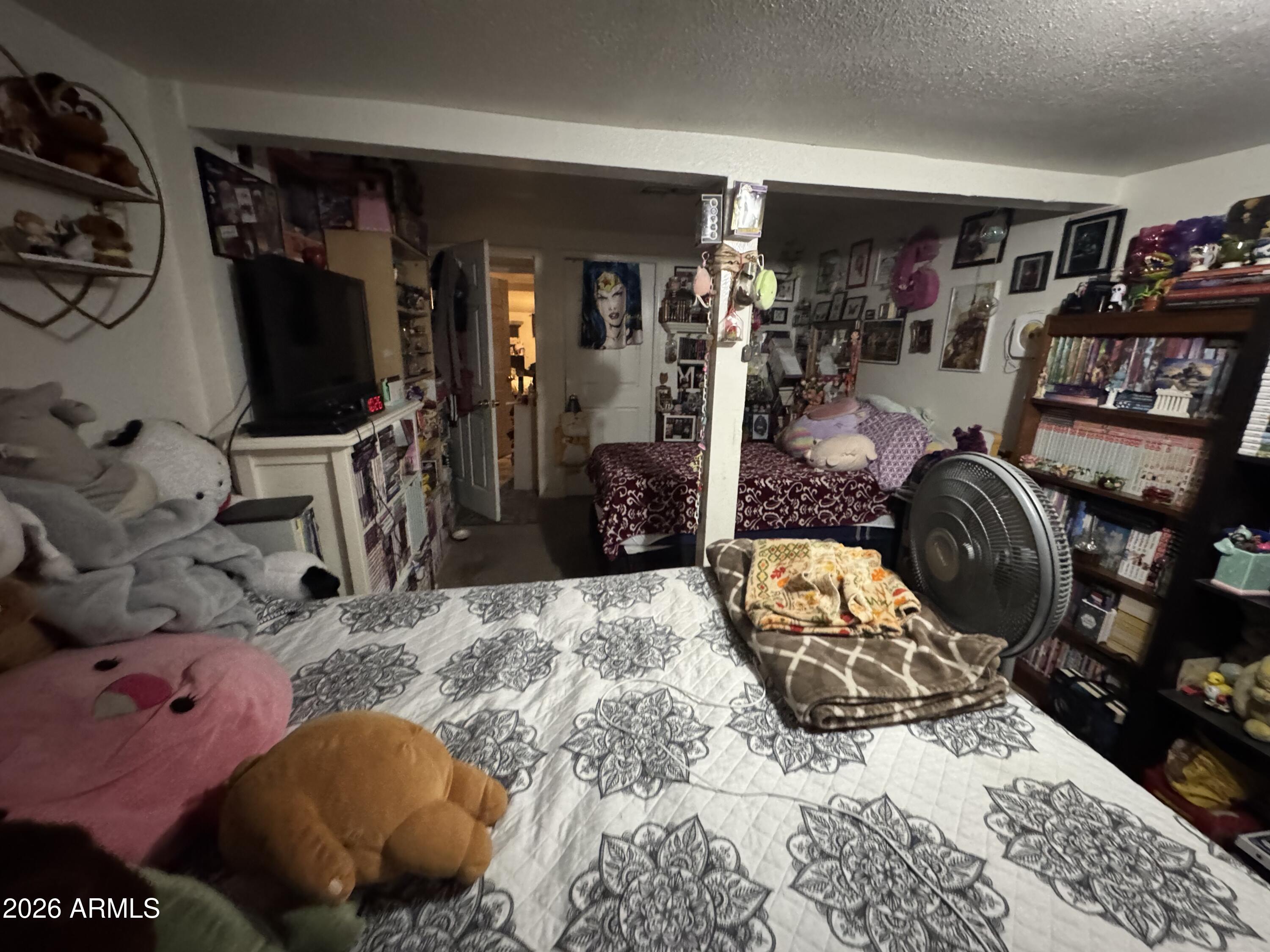 740 West Cinnabar Avenue Phoenix, AZ 85021 - Photo 22 of 26 a bedroom with furniture and a flat screen tv