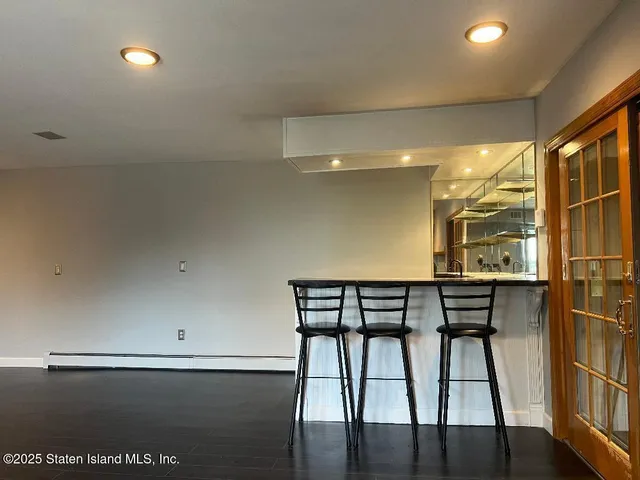 a view of a chairs and table in a room