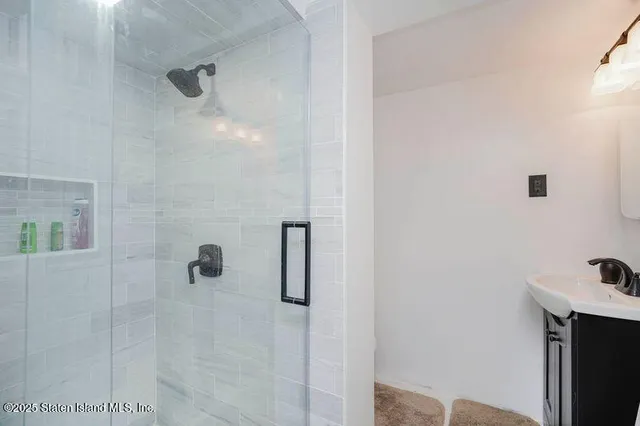 a bathroom with a sink and mirror
