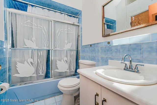 a bathroom with a toilet a sink and a shower