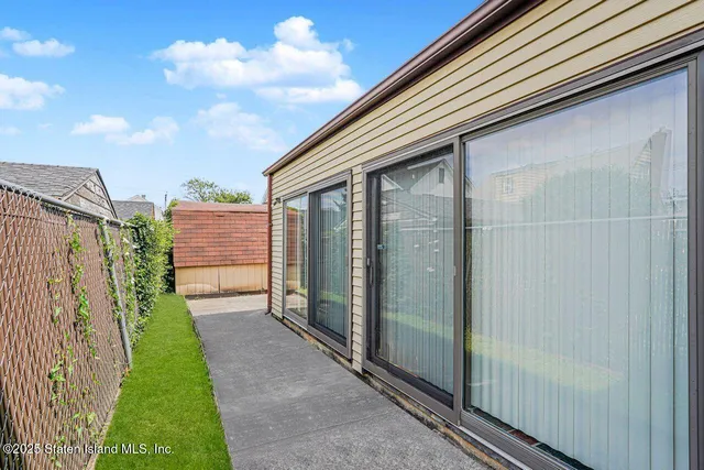 a backyard view with a garden
