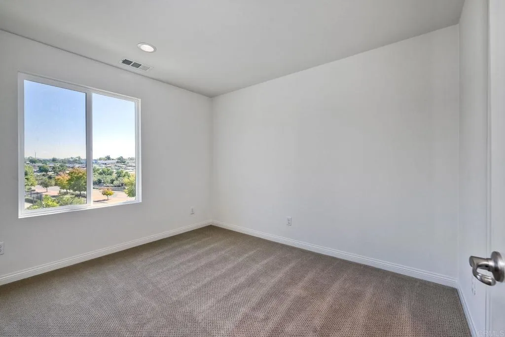 295 Mission Villas Road San Marcos, CA 92069 - Photo 13 of 29 an empty room with a window