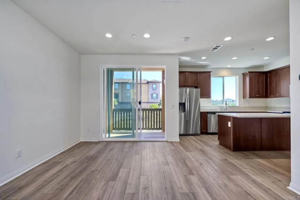 295 Mission Villas Road San Marcos, CA 92069 - Photo 28 of 29 a view of a kitchen with a sink and a refrigerator