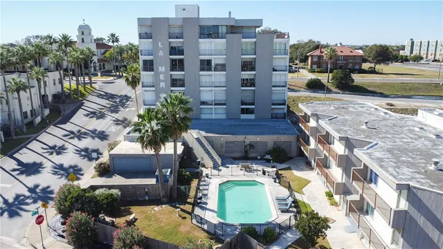 an aerial view of a house with a swimming pool