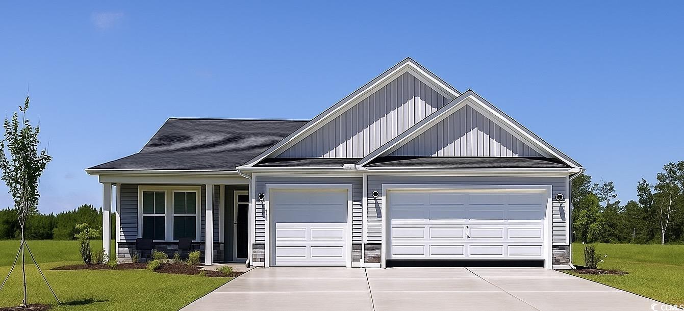 521 Sheepbridge Way Longs, SC 29568 - Photo 1 of 2 View of front of property featuring driveway, a front yard, a garage, and covered porch