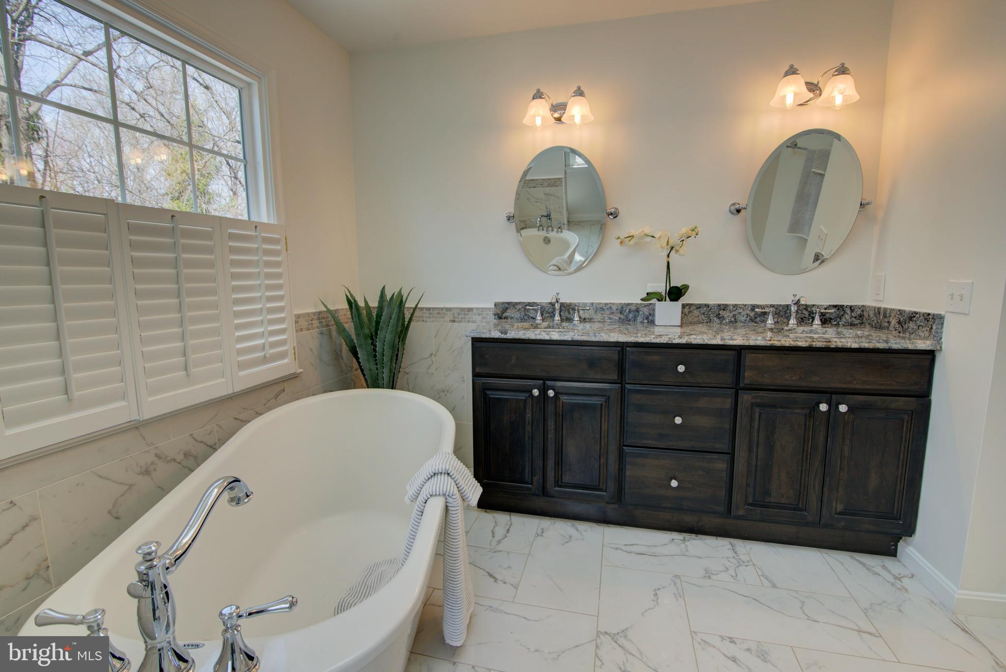 11620 Springhouse Place Reston, VA 20194 - Photo 16 of 31 Dual Sink Vanity
and Indulgent Soaking Tub.
