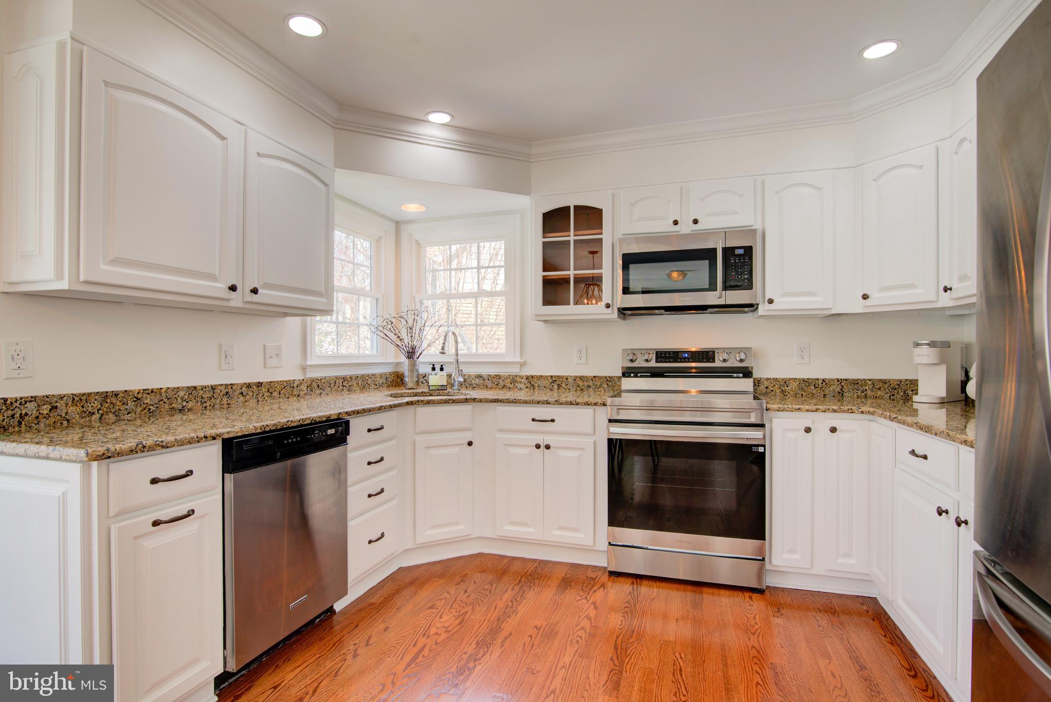 11620 Springhouse Place Reston, VA 20194 - Photo 5 of 31 White Kitchen with Corner Window, Granite Counters