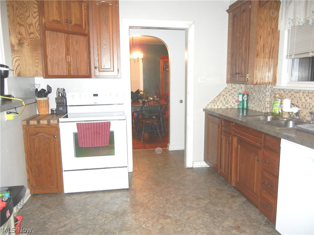 1105 Raff Road Southwest Canton, OH 44710 - Photo 6 of 15 Area of kitchen showing range area looking into mud room area and dining room