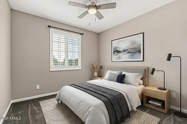 a bedroom with bed and window