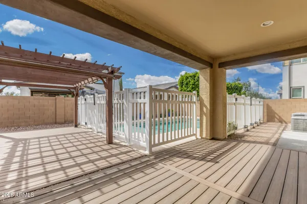a view of a balcony with wooden floor