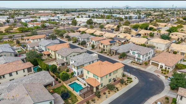 an aerial view of residential houses with outdoor space