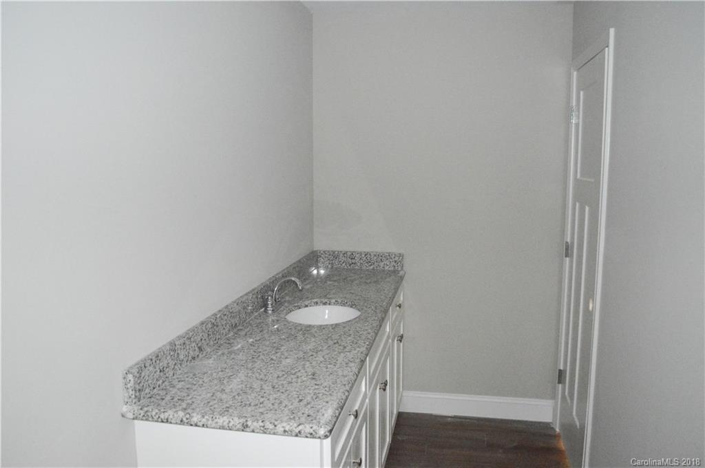 4831 Kemp Dellinger Road Maiden, NC 28650 - Photo 13 of 20 a bathroom with a granite countertop sink and vanity