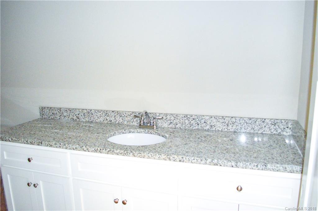 4831 Kemp Dellinger Road Maiden, NC 28650 - Photo 9 of 20 a bathroom with a granite countertop sink and a mirror