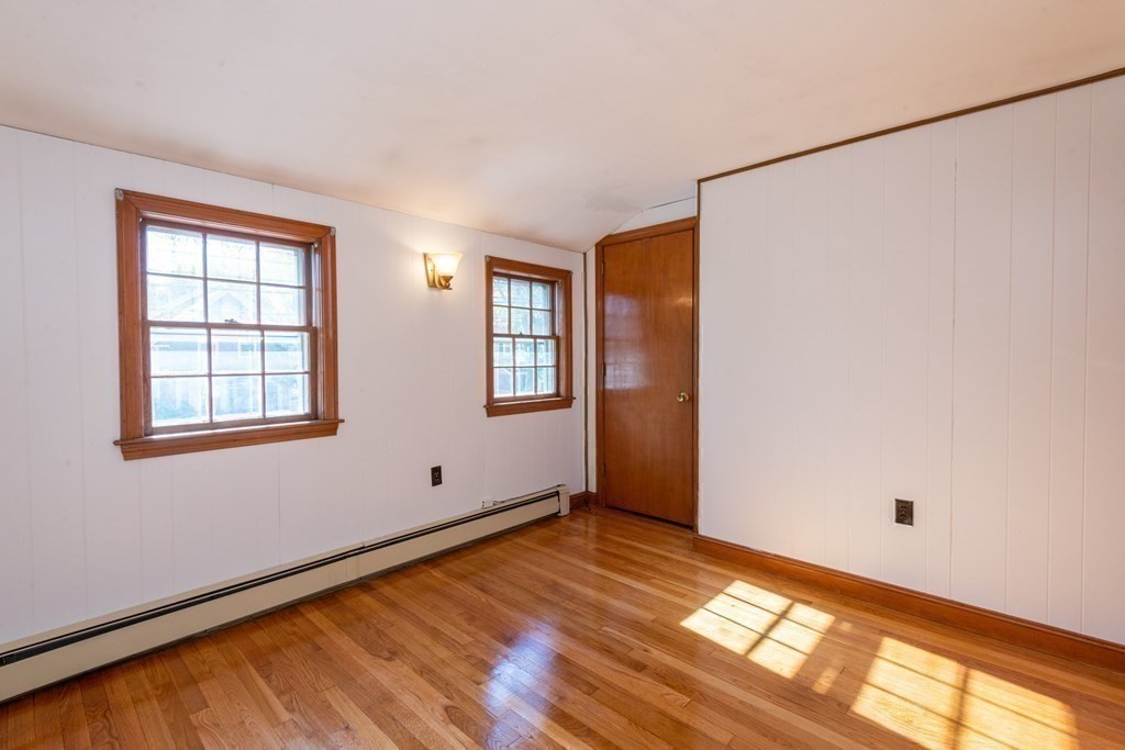 114 Spring Street Stoneham, MA 02180 - Photo 26 of 41 a view of empty room with wooden floor and fan