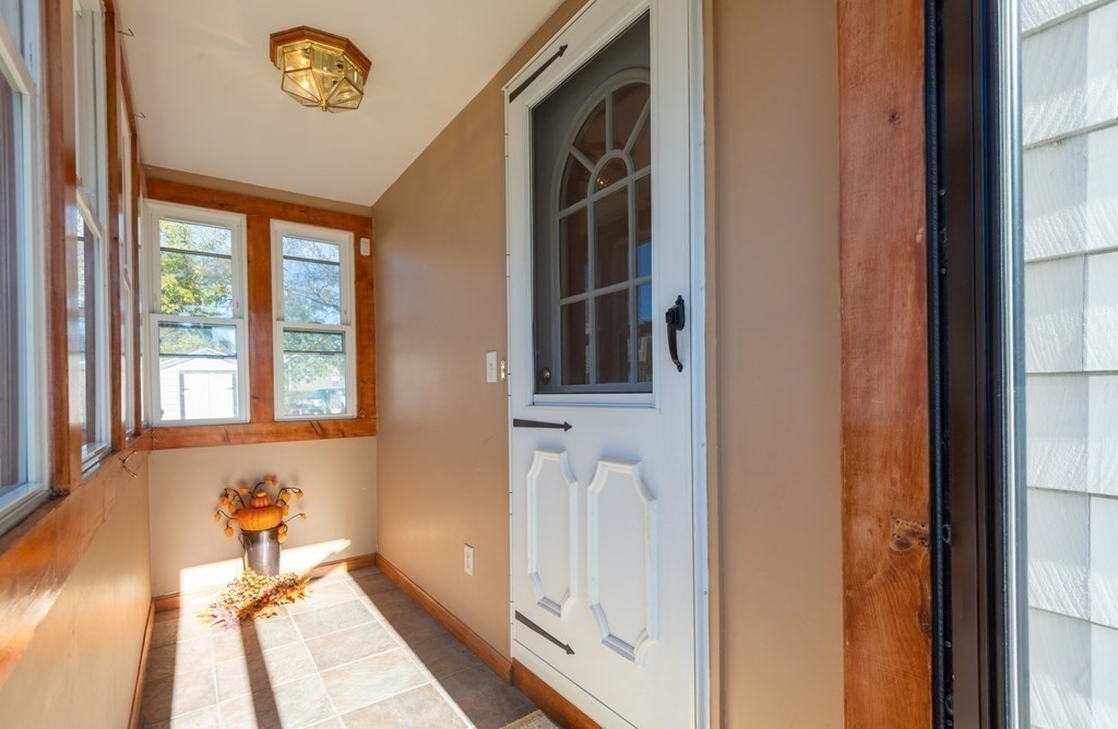 114 Spring Street Stoneham, MA 02180 - Photo 36 of 41 a bath room with a bathtub and a window