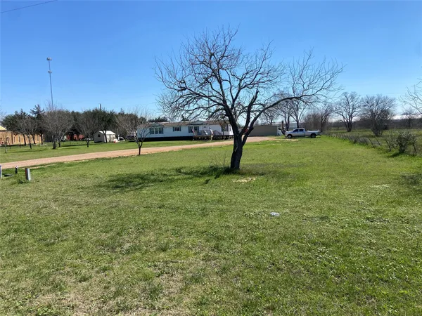 a view of backyard with green space