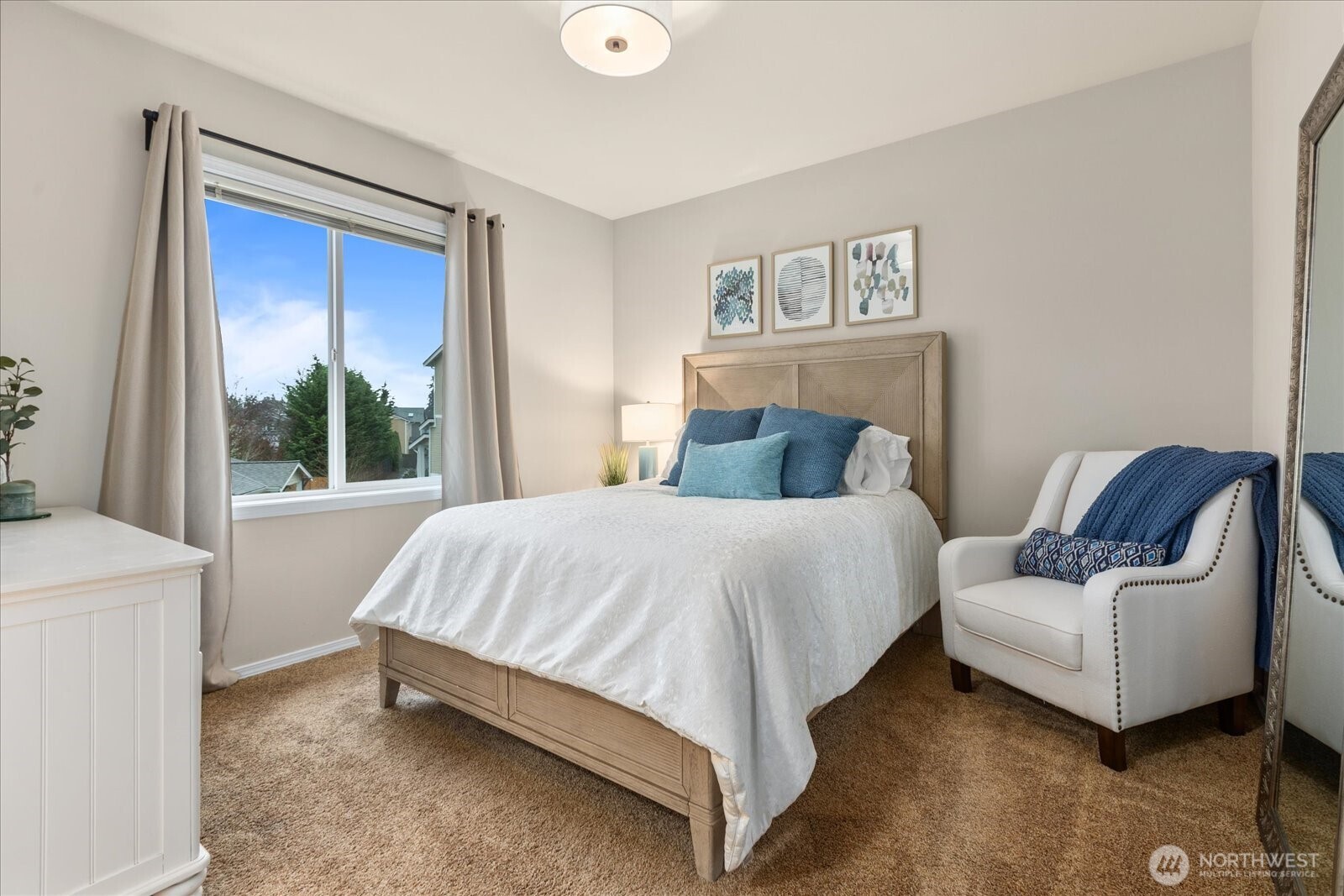 14915 38th Drive Southeast, Unit S1148 Bothell, WA 98012 - Photo 15 of 37 a bed sitting in a bedroom next to a window