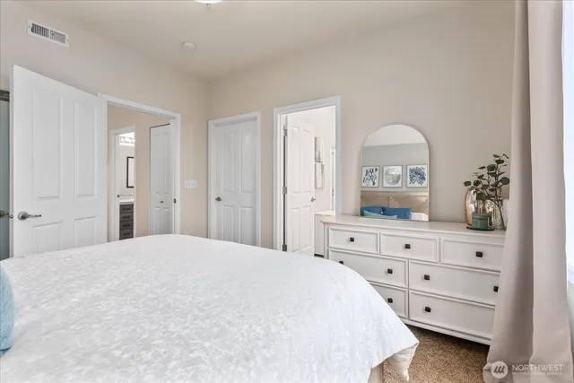 a bedroom with a bed and a dresser