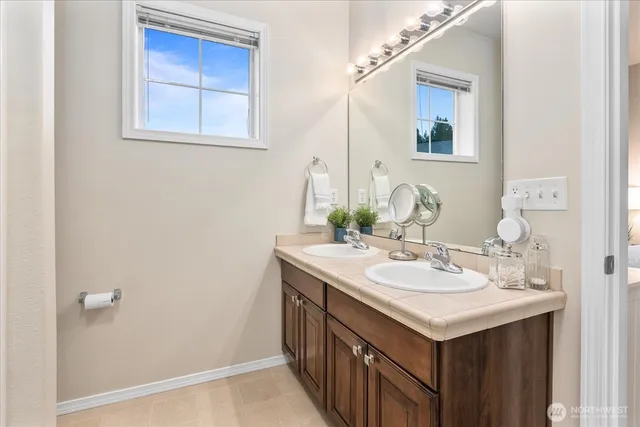 a bathroom with a sink and a mirror