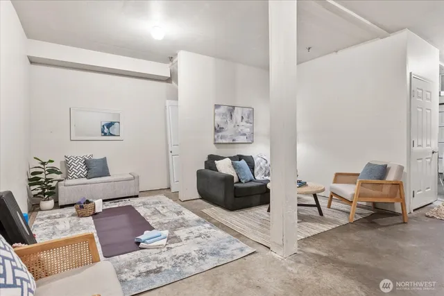 a living room with furniture and rug