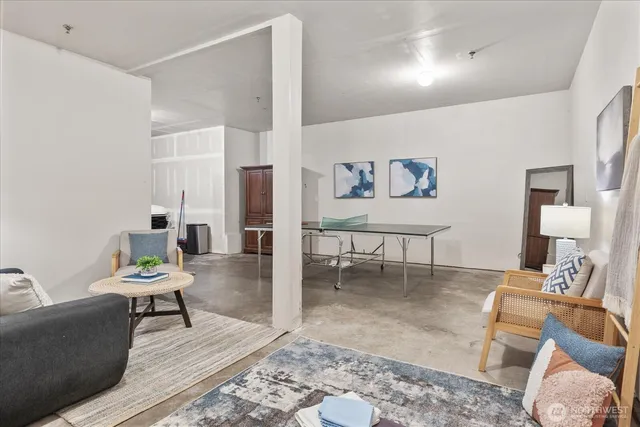 a living room with furniture and a rug