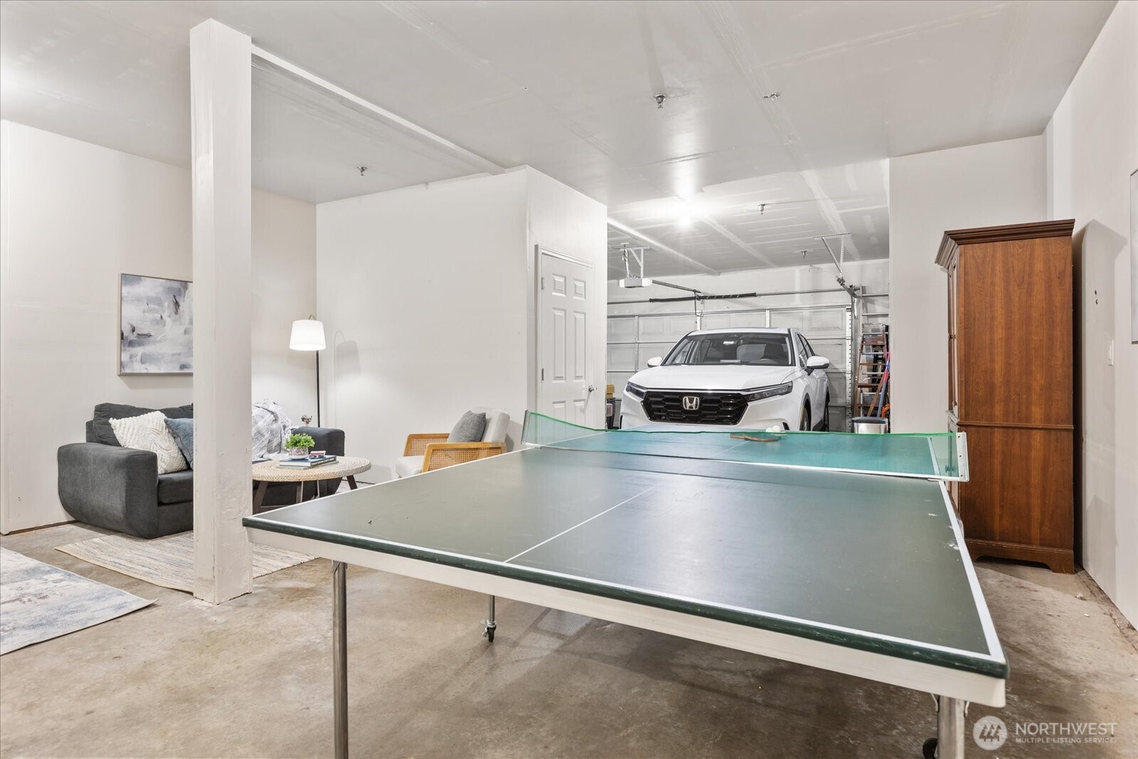 14915 38th Drive Southeast, Unit S1148 Bothell, WA 98012 - Photo 29 of 37 a kitchen with stainless steel appliances granite countertop a refrigerator and a stove