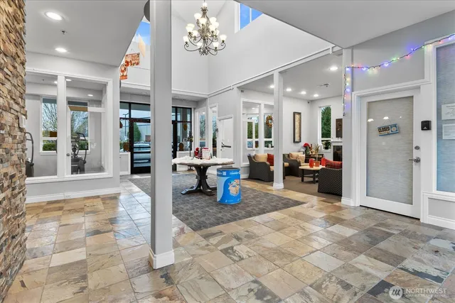 a view of a lobby with a lots of dining space and furniture