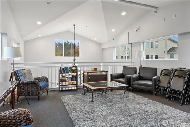 a living room with furniture and a rug