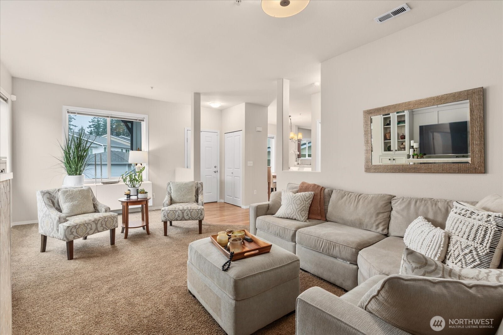 14915 38th Drive Southeast, Unit S1148 Bothell, WA 98012 - Photo 6 of 37 a living room with furniture and a large window