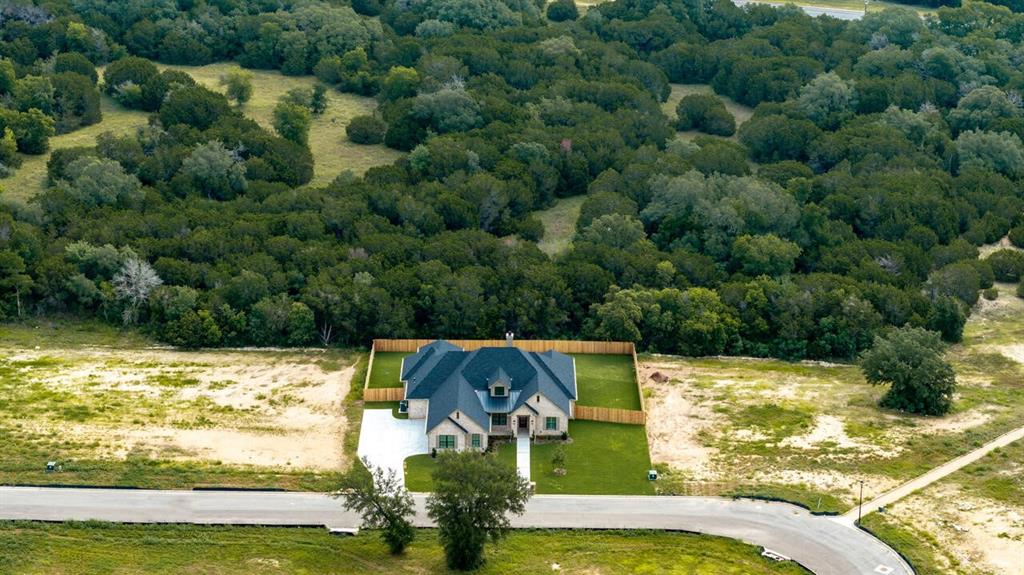 8005 Bee Cave Road China Spring, TX 76633 - Photo 4 of 40 a view of a swimming pool with a yard